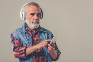OTvest-Anxiety-Older_man_with_headphones_and_vest
